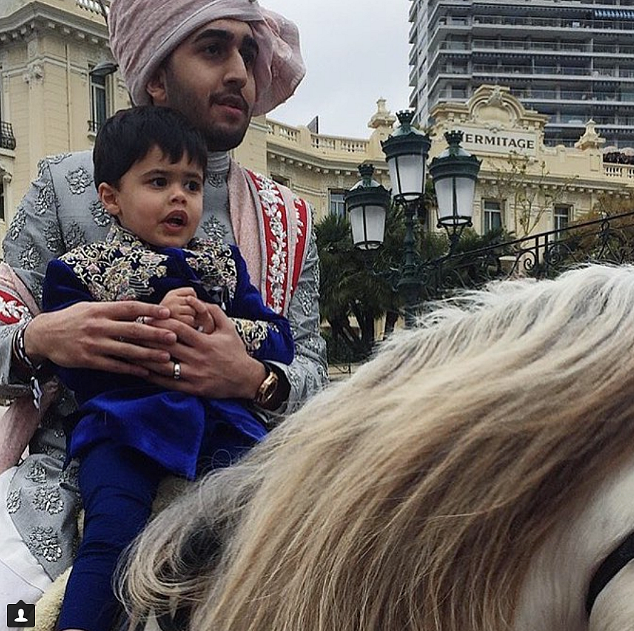 The groom seen on a white horse during the <i>baarat</i>.&nbsp;