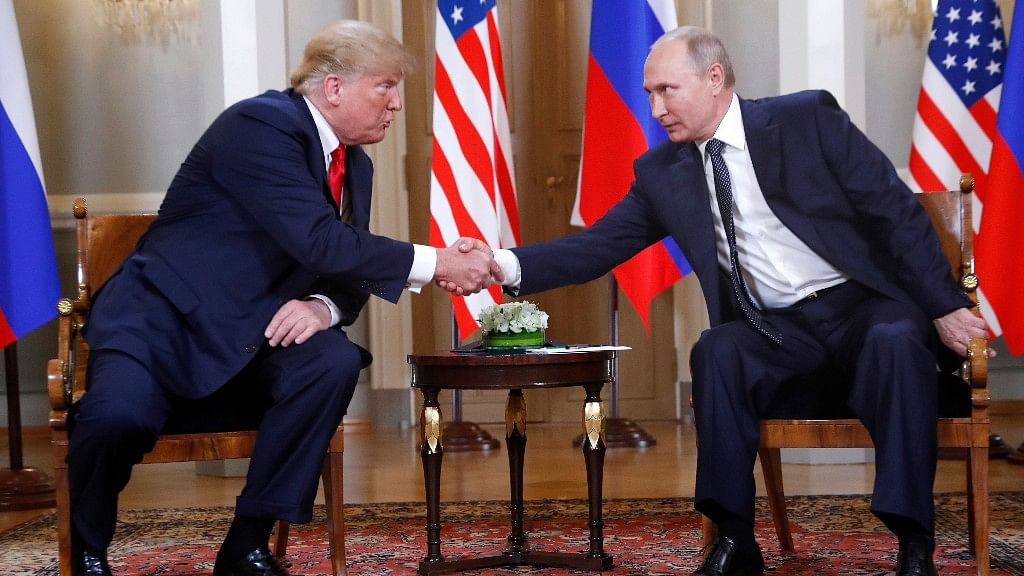 Trump and Putin shake hands at the Helsinki summit.