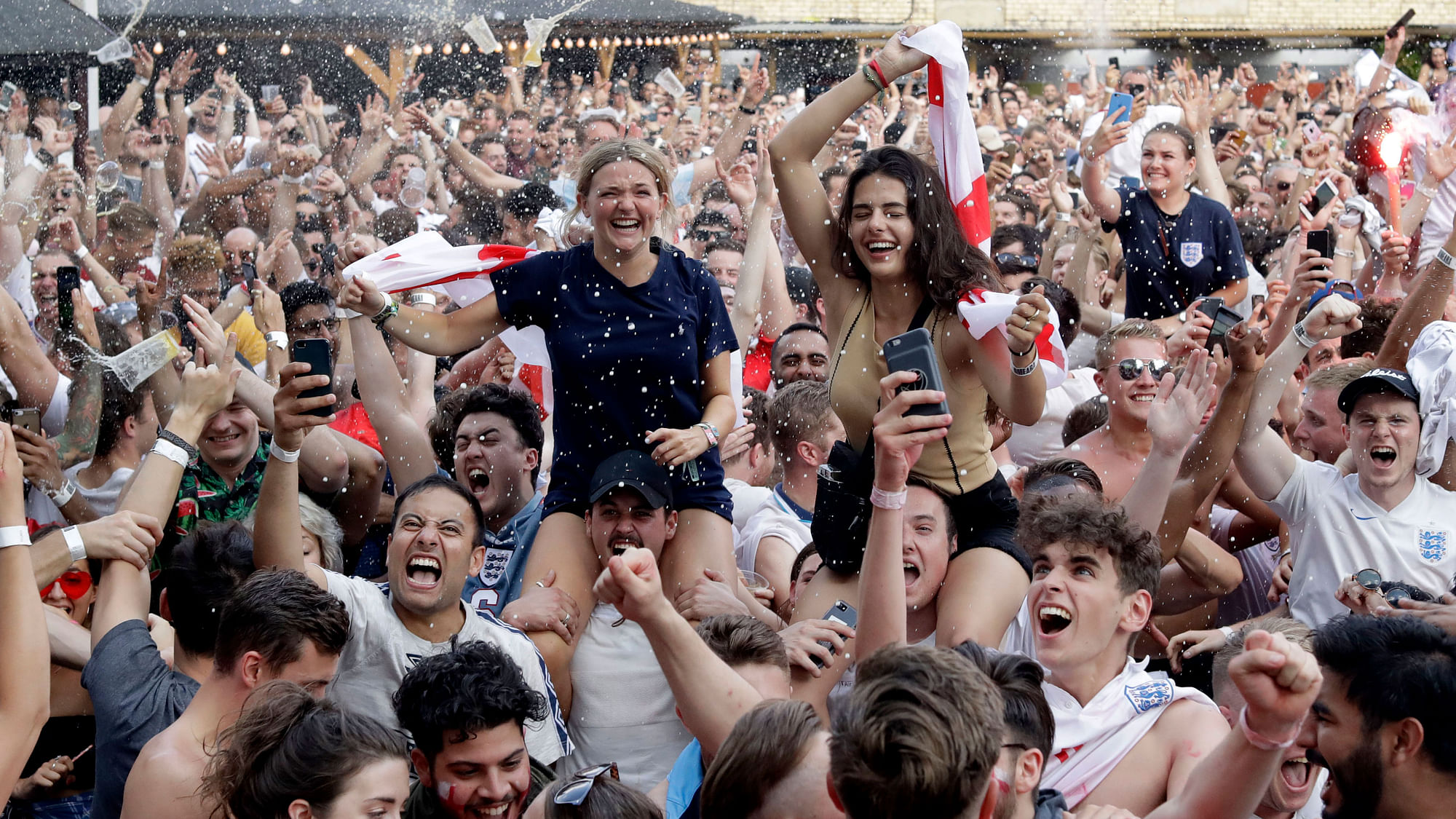 Fans celebrate after English reach their first World Cup semi-final in 28 years.