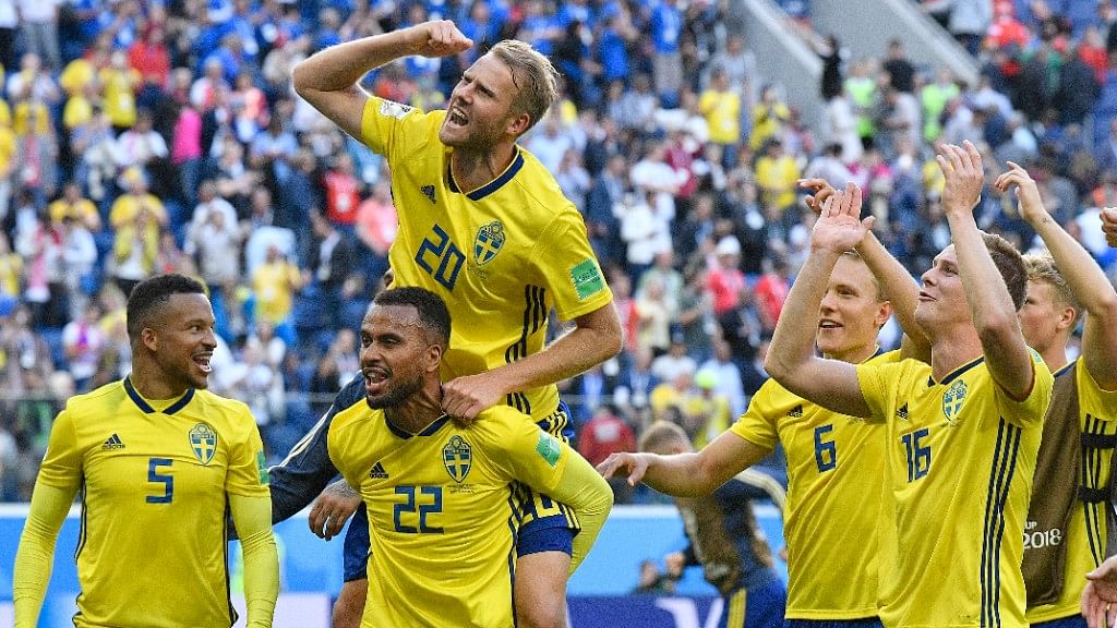 Sweden teammates celebrate after winning their Round of 16 match against Switzerland at the St. Petersburg Stadium on Tuesday.&nbsp;