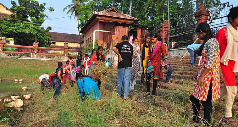 Volunteers cleaning the village pond