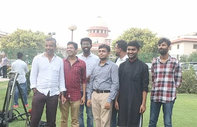 New Delhi: Krishna Reddy M, Romel Barel and Anwesh Pokkuluri - the three out of a batch of 20 current and former students of Indian Institutes of Technology who had filed a petition against Section 377 of the Indian Penal Code that makes homosexuality a crime, outside the Supreme Court, in New Delhi on July 10, 2018. (Photo: IANS)