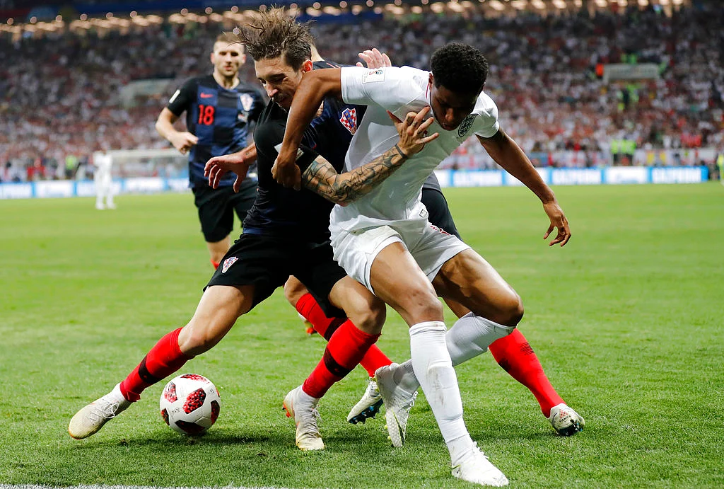England’s Marcus Rashford, right, and Croatia’s Sime Vrsaljko challenge for the ball.