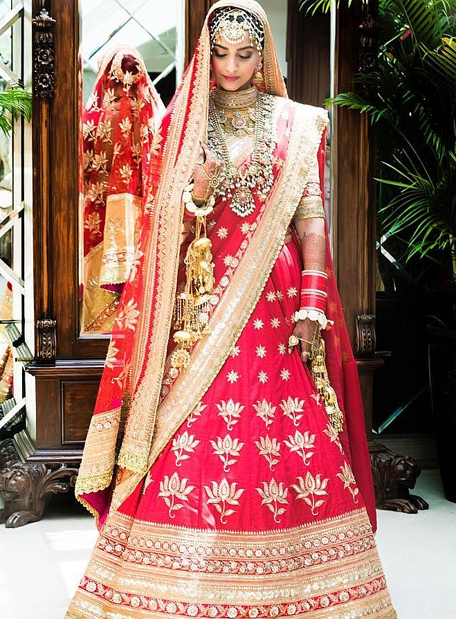 Sonam surprised the world by choosing to wear a traditional red and gold <i>lehenga</i> by the Anuradha Vakil.