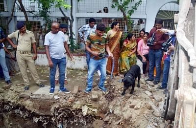 Muzaffarpur: Digging work underway in the premises of Seva Sankalp Evam Vikas Samiti, a state-run shelter home on Sahu Road in Muzaffarpur to exhume the body of girl who was suspected to be buried after beaten up badly; on July 23, 2018.  Last week, a medical examination of 44 girls belonging to the home revealed that 21 were raped at Balika Grih. The district police have arrested an official of the home. (Photo: IANS)