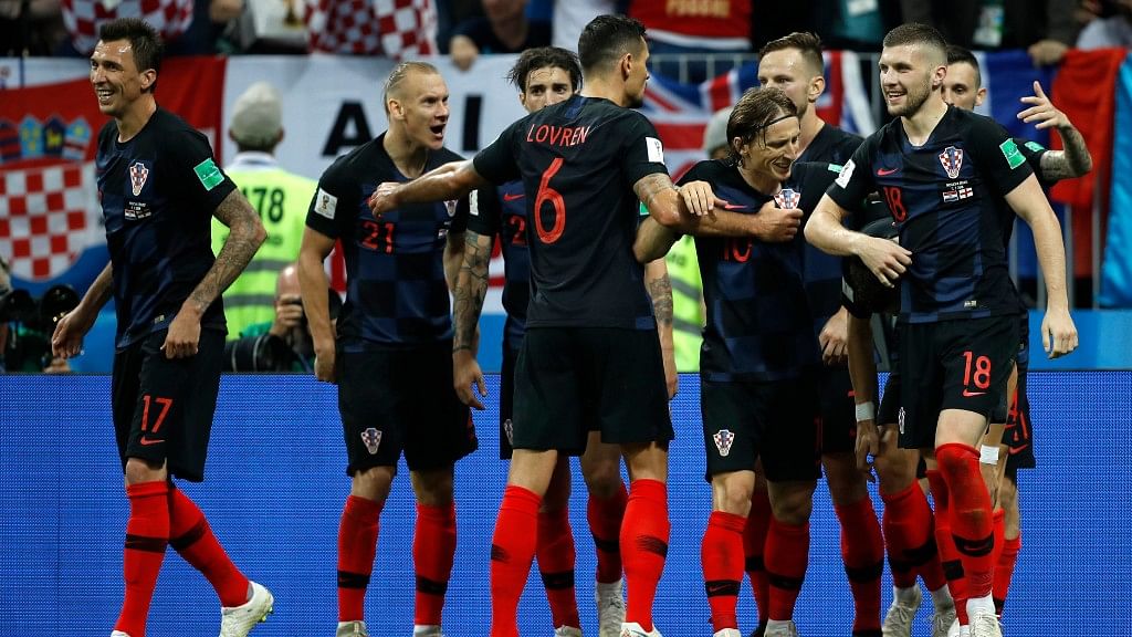 The Croatian team celebrates reaching the final of the 2018 FIFA World Cup in Russia