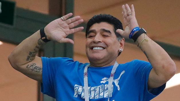 Diego Maradona gestures during the match between Argentina and Croatia.&nbsp;