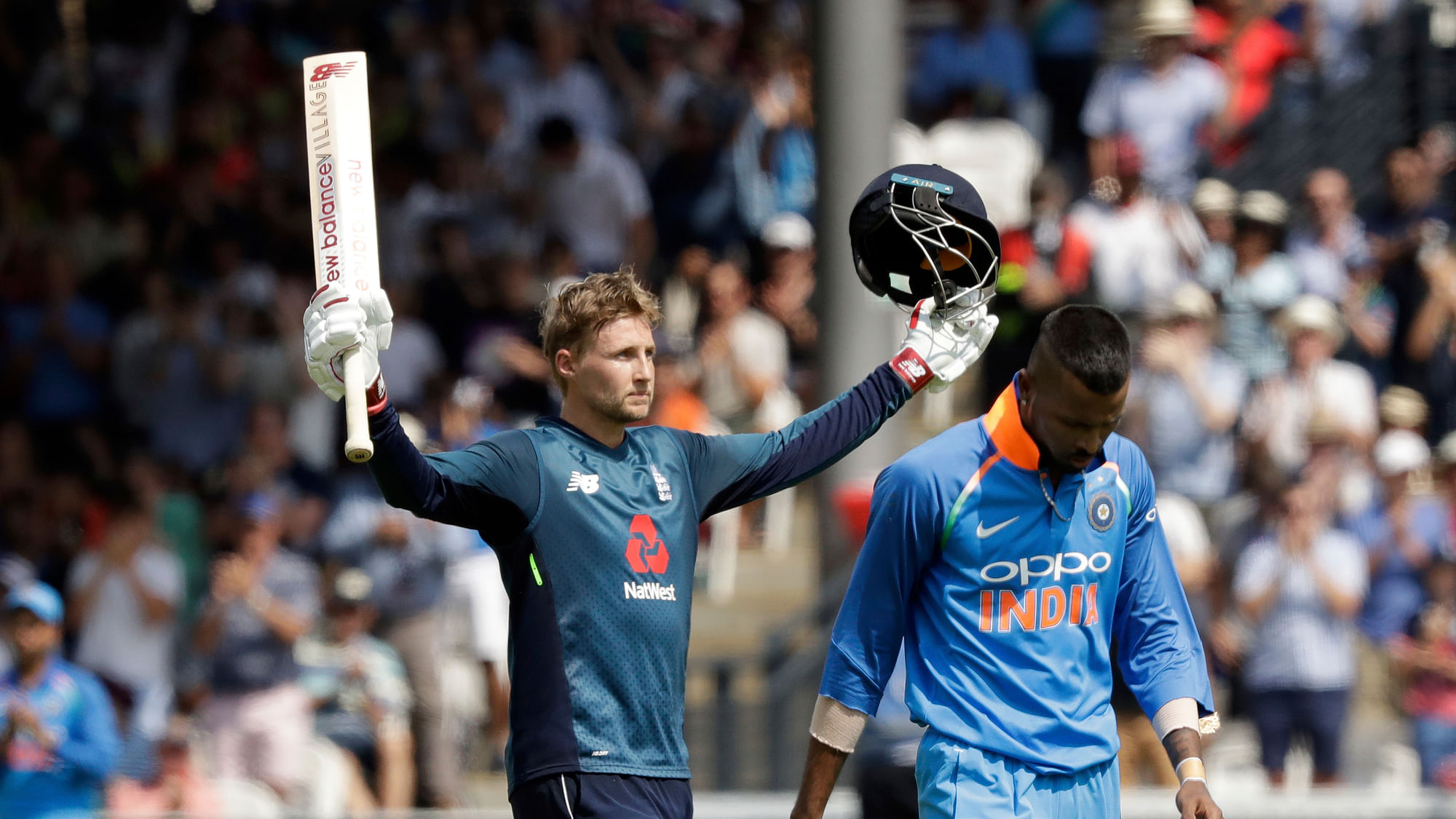 England’s Joe Root celebrates his century nest to India’s Hardik Pandya during the one day cricket match between England and India at Lord’s cricket ground in London.