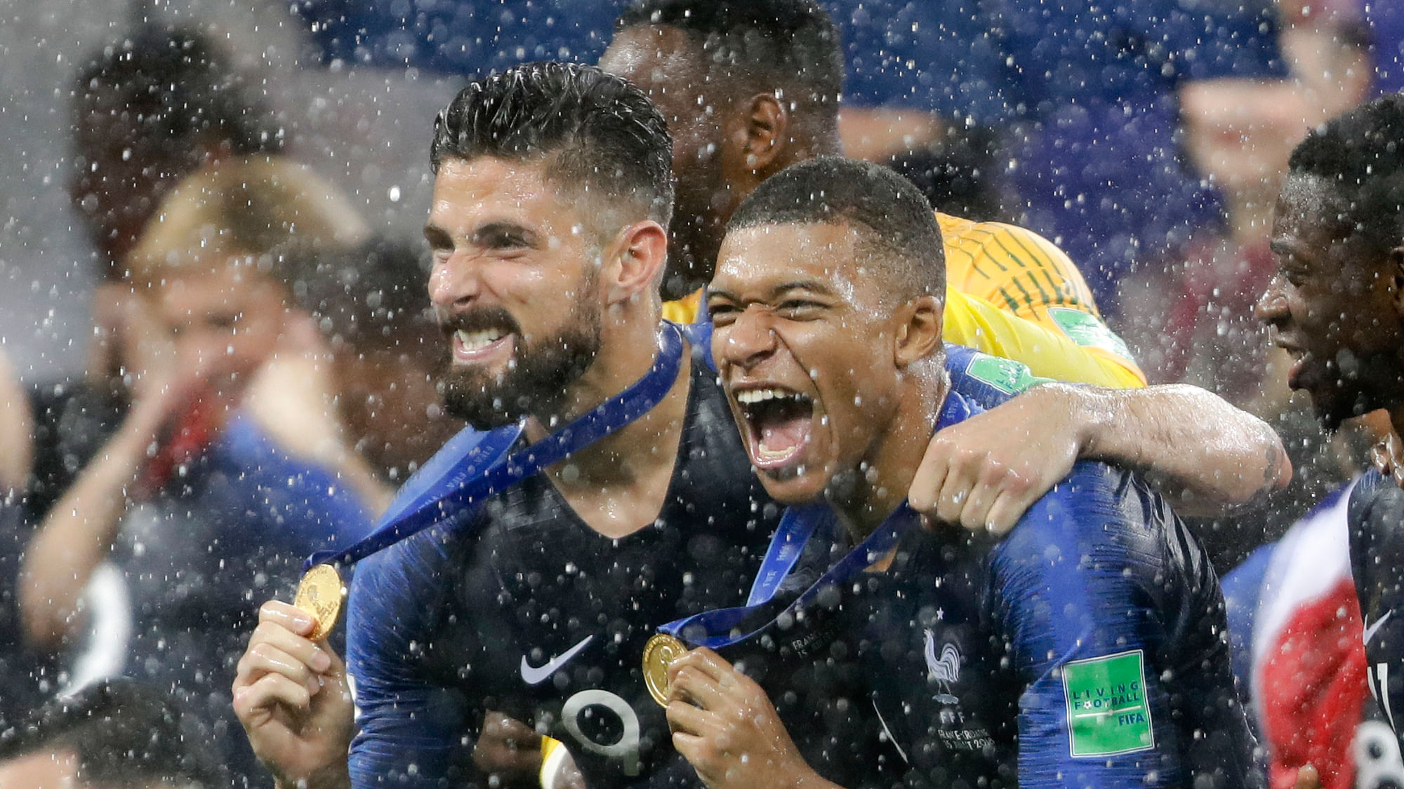 France’s Kylian Mbappe, right, and teammate Olivier Giroud celebrates after the final match between France and Croatia at the 2018 soccer World Cup in the Luzhniki Stadium in Moscow, Russia, Sunday, July 15, 2018.