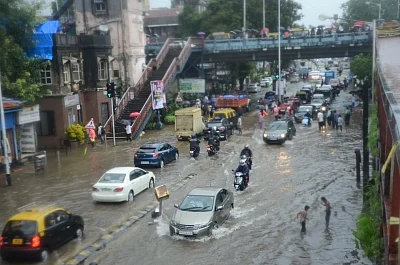 Mumbai: A view of the flooded streets as heavy rains continued to batter Mumbai for the fourth day, on July 10, 2018. Areas like Dahisar, Borivali, Malad, Jogeshwari, Andheri, Santacruz, Mahim, Kurla, Parel, Dadar, Chembur, King Circle, Sion, Wadala, Masjid Bunder, Ghatkopar, Powai, Bhandup and others experienced heavy waterlogging, impeding traffic and pedestrian movement. (Photo: IANS)