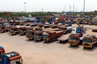 Chennai: Trucks remain parked in a Chennai depot on July 20, 2018. Over 90 lakh trucks and around 50 lakh buses, tempos and tourist vehicles went off the roads on Friday as their owners began an indefinite strike to press for their various demands, including reduction in diesel prices. Pick-up or delivery of goods has been hit from manufacturing to consumer centres, cargo transport from airports, seaports and railway yards has been halted while movement of people in private buses and tourist veh