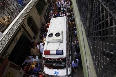 New Delhi: An ambulance parked at the site where 11 members of a family were found dead -- some blindfolded and hanging from an iron grill ceiling -- at their home, in New Delhi on July 1, 2018. According to Joint Commissioner of Police Rajesh Khurana, while some bodies of them were found hanging from an iron grill ceiling (used as a ventilator) in the courtyard while others were lying on the floor blindfolded with their hands and legs tied. The bodies were sent for post mortem to ascertain the