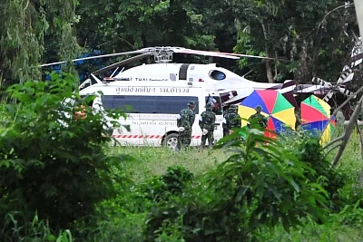 CHIANG RAI, July 10, 2018 (Xinhua) -- An evacuation helicopter and an ambulance are seen in Mae Sai district of Chiang Rai province, Thailand, July 10, 2018. All 12 boys and their football coach have been rescued from a flooded cave in northern Thailand after being trapped for 18 days, Thai navy SEALs confirmed on Tuesday. (Xinhua/Rachen Sageamsak/IANS)