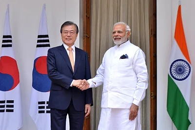 New Delhi: Prime Minister Narendra Modi and South Korean President Moon Jae-in head for a meeting at Hyderabad House, in New Delhi on July 10, 2018. (Photo: IANS)