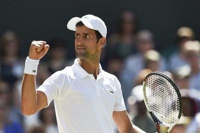 LONDON, July 16, 2018 (Xinhua) -- Novak Djokovic of Serbia reacts during the men