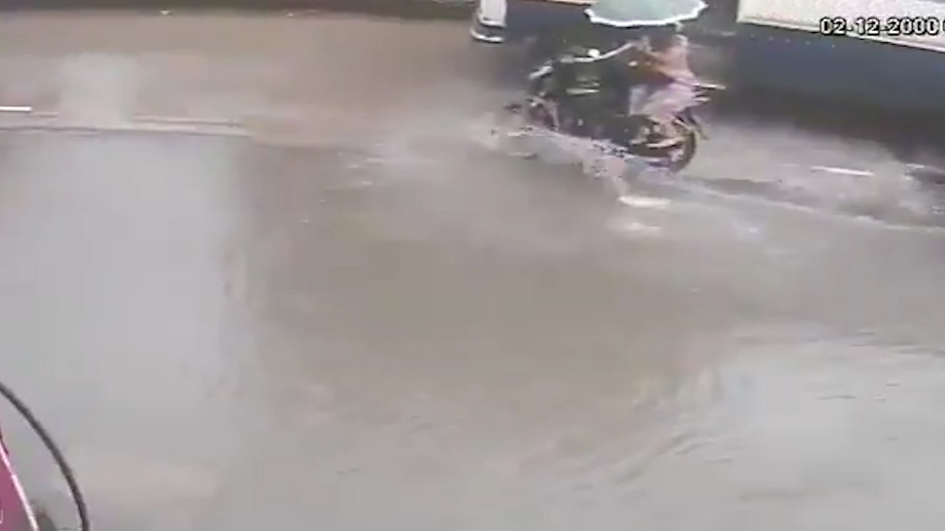 A 40-year-old woman was killed by a speeding bus after she fell off a bike that hit a pothole during heavy rains.