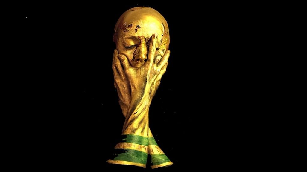 Make-up artists Emma Allen transforms into the World Cup Trophy