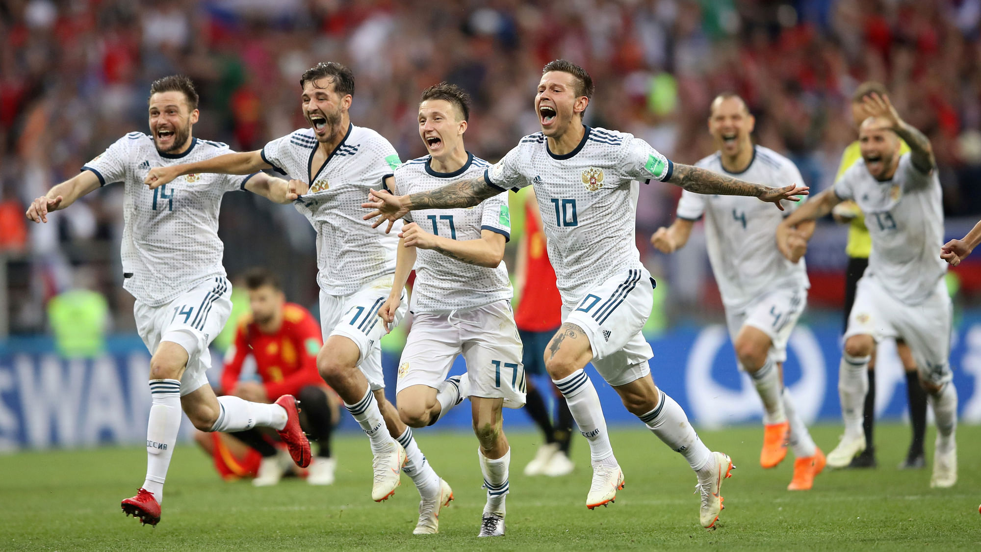 Russia players celebrate after winning the penalty shootout against Spain in the Round of 16 of the FIFA World Cup.
