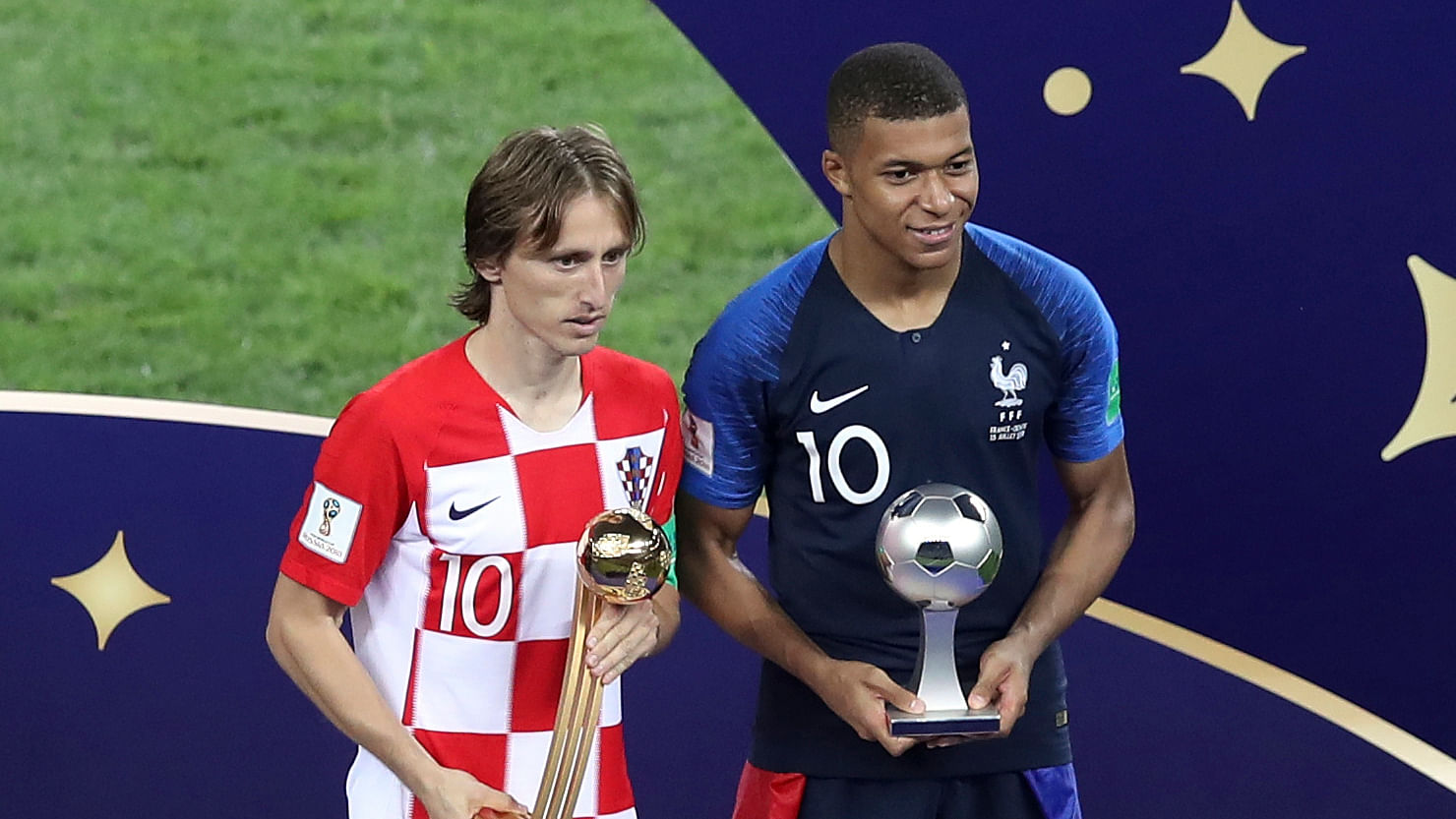 Croatia’s Luka Modric and France’s Kylian Mbappe, right, pose with their individual awards at the end of the final match between France and Croatia at the 2018 soccer World Cup in the Luzhniki Stadium in Moscow, Russia, Sunday, July 15, 2018.&nbsp;