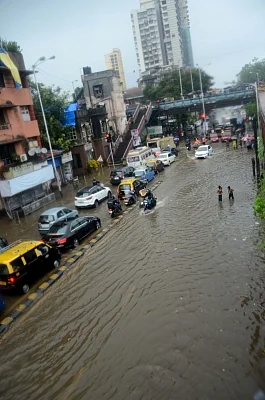 Mumbai: A view of the flooded streets as heavy rains continued to batter Mumbai for the fourth day, on July 10, 2018. Areas like Dahisar, Borivali, Malad, Jogeshwari, Andheri, Santacruz, Mahim, Kurla, Parel, Dadar, Chembur, King Circle, Sion, Wadala, Masjid Bunder, Ghatkopar, Powai, Bhandup and others experienced heavy waterlogging, impeding traffic and pedestrian movement. (Photo: IANS)
