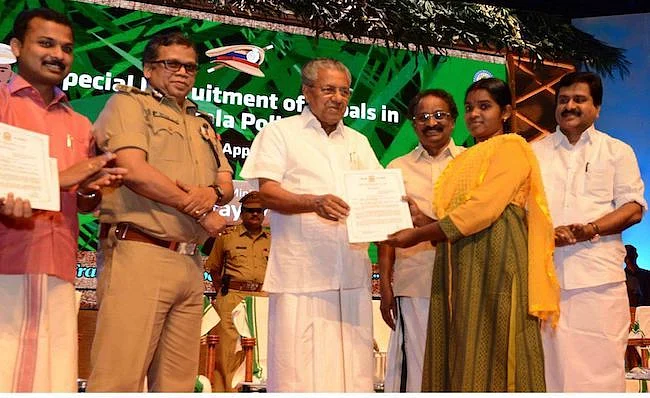 Kerala CM Pinarayi Vijayan and state police chief Loknath Behera at the appointment of 74 Scheduled Tribes members hailing from forest and forest bordering areas. 