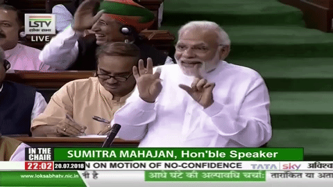 Who was the smiling neta behind Modi during the no-trust vote? 