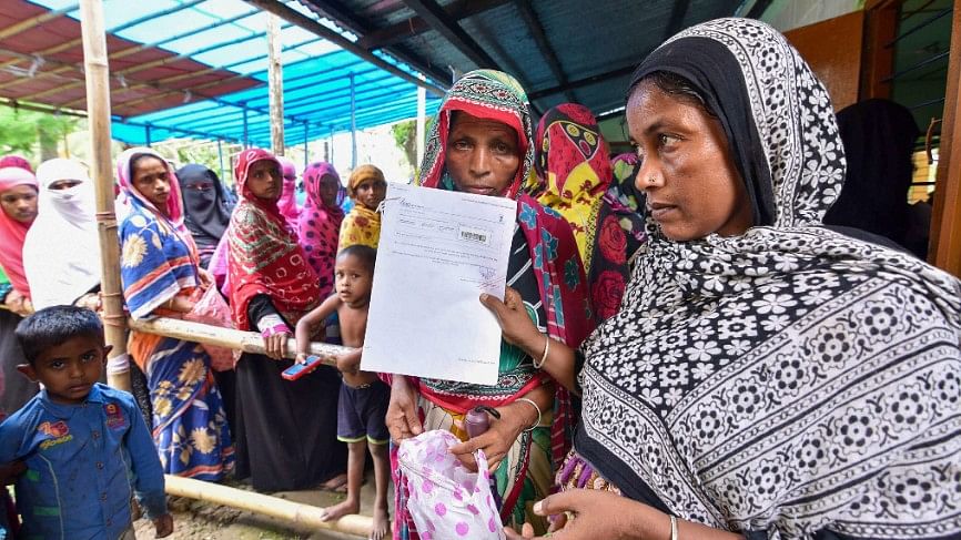 People wait to check their names on the final draft of the Assam National Register of Citizens after it was released, at an NRC Seva Kendra in Nagaon 30 July. Image used for representation.