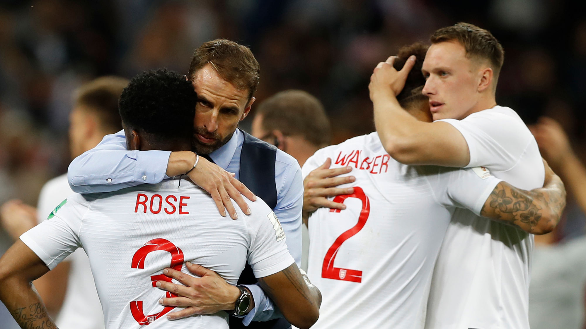 England head coach Gareth Southgate, 2nd left, comforts England’s Danny Rose, left, after loosing the semifinal match between Croatia and England at the 2018 soccer World Cup in the Luzhniki Stadium in Moscow, Russia, Wednesday, July 11, 2018.&nbsp;