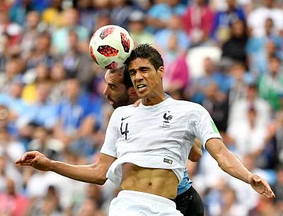 NIZHNY NOVGOROD, July 6, 2018 (Xinhua) -- Diego Godin (L) of Uruguay competes for a header with Raphael Varane of France during the 2018 FIFA World Cup quarter-final match between Uruguay and France in Nizhny Novgorod, Russia, July 6, 2018. (Xinhua/Liu Dawei/IANS)