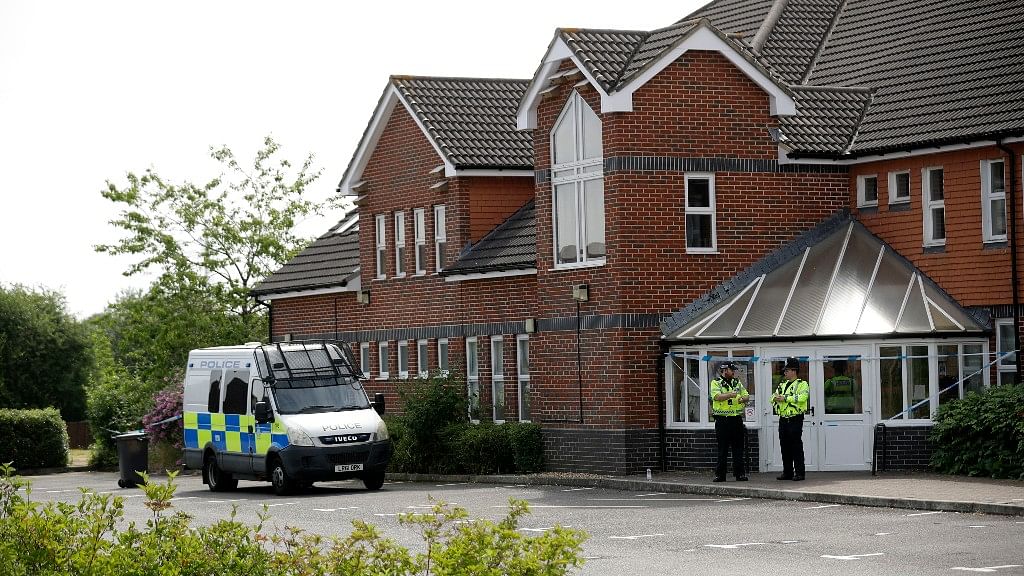 British police officers guard a cordon outside the Amesbury Baptist Centre church in Amesbury, England, on 4 July.