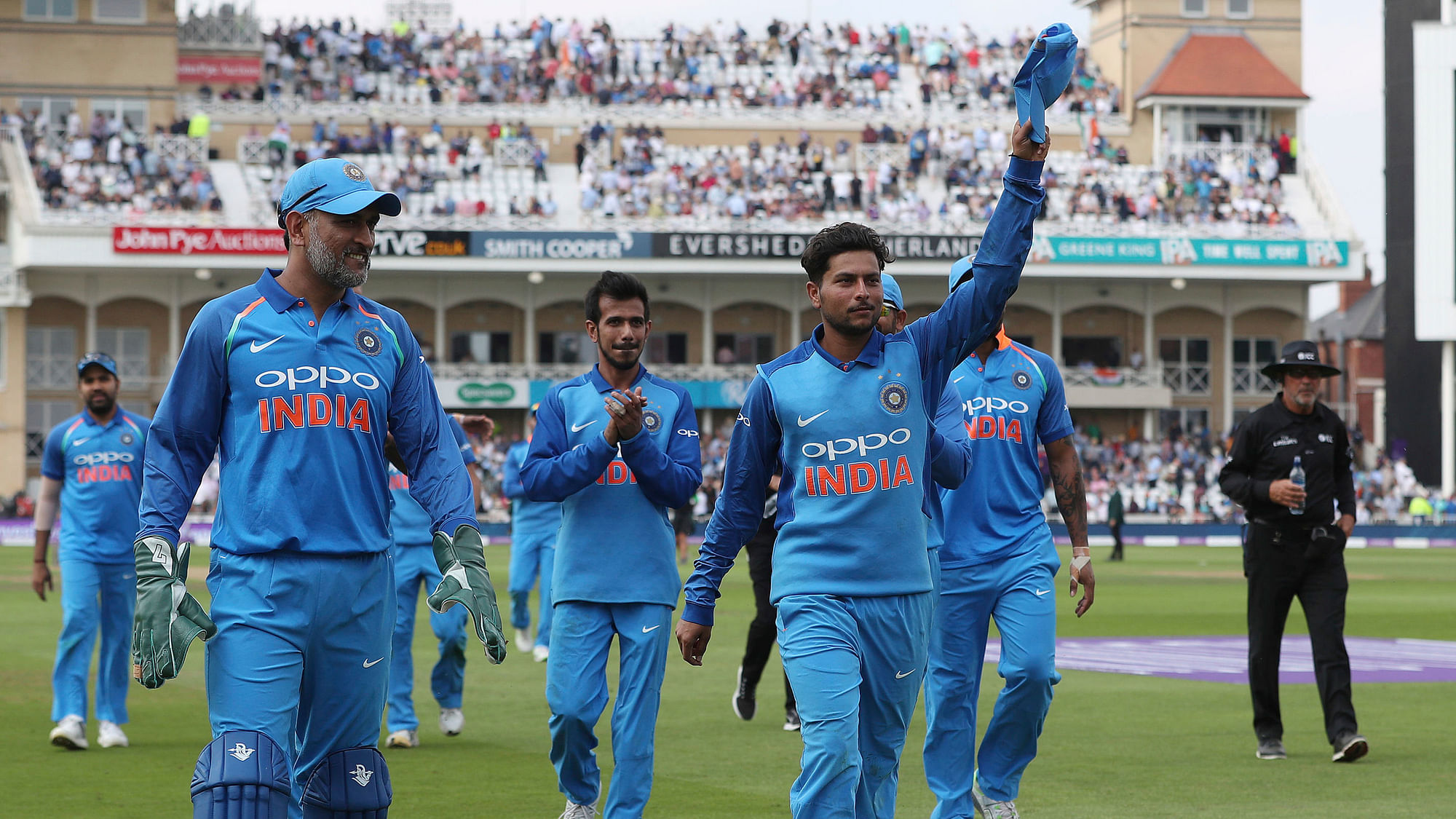 Kuldeep Yadav leads the Indian team off the field after finishing with a haul of 6/2 against England.