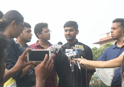 New Delhi: Krishna Reddy M, Romel Barel and Anwesh Pokkuluri - the three out of a batch of 20 current and former students of Indian Institutes of Technology who had filed a petition against Section 377 of the Indian Penal Code that makes homosexuality a crime, talk to the media outside the Supreme Court, in New Delhi on July 10, 2018. (Photo: IANS)