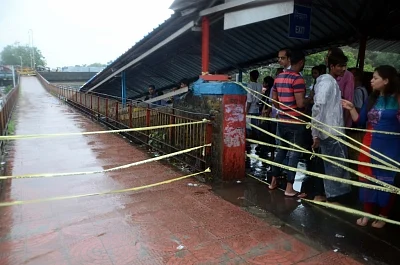 Mumbai: The bridge on Grant Road station of Western Railway closed as heavy rains continued to batter Mumbai for the fourth day, on July 10, 2018. Areas like Dahisar, Borivali, Malad, Jogeshwari, Andheri, Santacruz, Mahim, Kurla, Parel, Dadar, Chembur, King Circle, Sion, Wadala, Masjid Bunder, Ghatkopar, Powai, Bhandup and others experienced heavy waterlogging, impeding traffic and pedestrian movement. (Photo: IANS)
