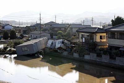 KURASHIKI, July 10, 2018 (Xinhua) -- Photo taken on July 10, 2018, shows submerged and destroyed houses in a flooded area in Kurashiki, Okayama Prefecture, Japan. The death toll in the wake of torrential rainfall causing flooding and landslides in western Japan reached 148 people, officials said Tuesday. (Xinhua/Ma Ping/IANS)