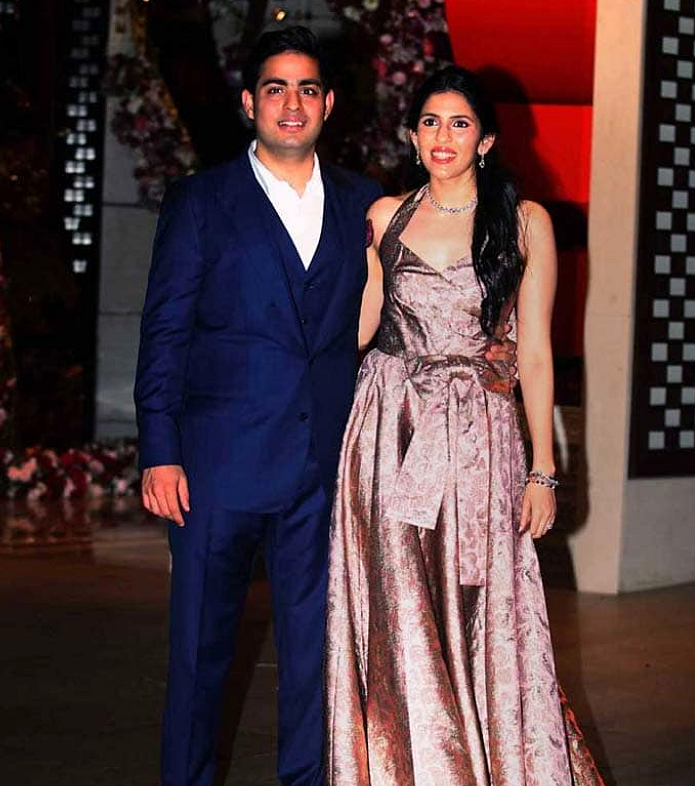 Shloka wore a custom made brocade Prada dress, while Akash wore a blue suit at the pre-engagement bash.&nbsp;