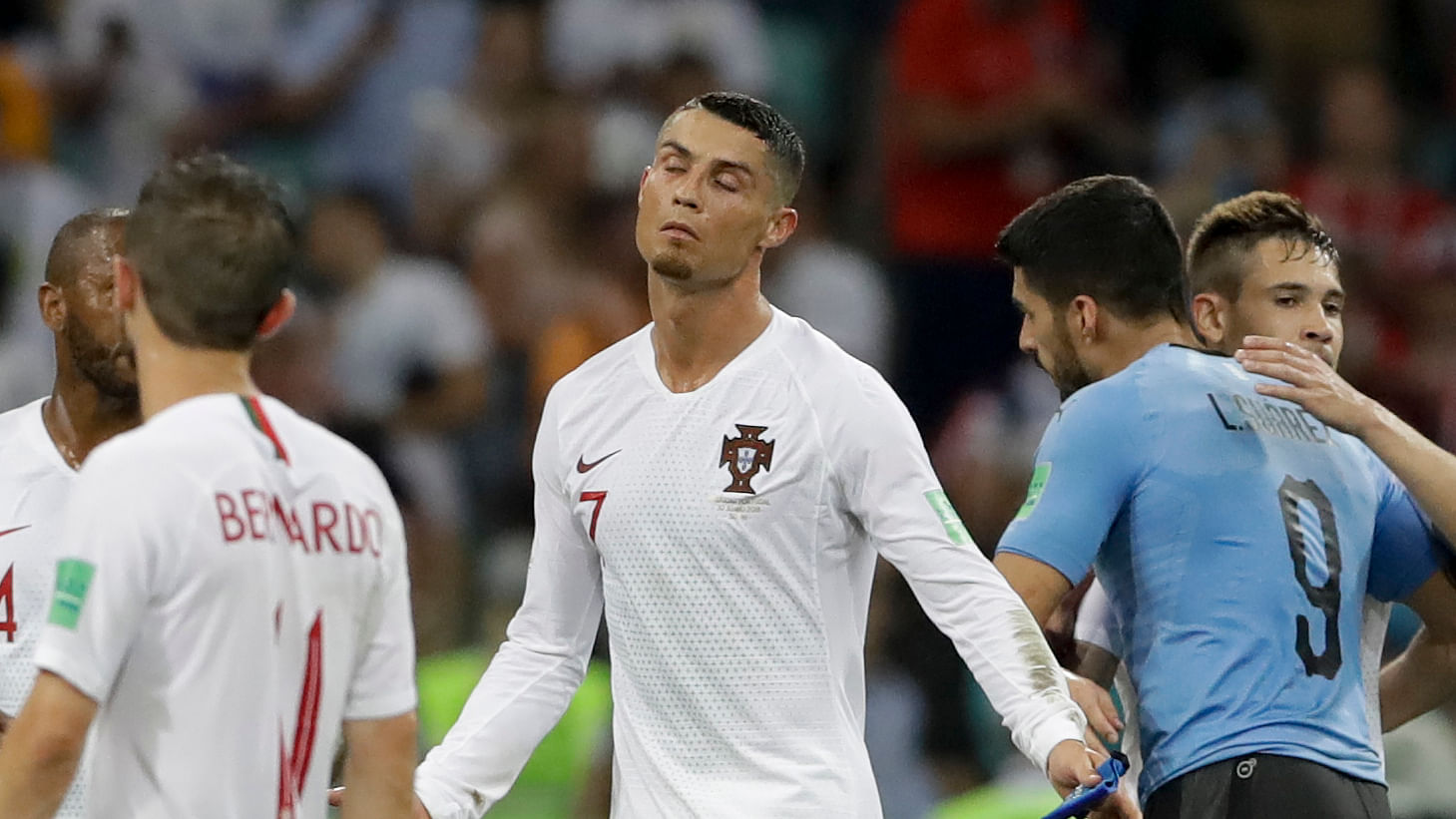 Portugal’s Cristiano Ronaldo, center, reacts after the round of 16 match between Uruguay and Portugal at the 2018 FIFA World Cup.