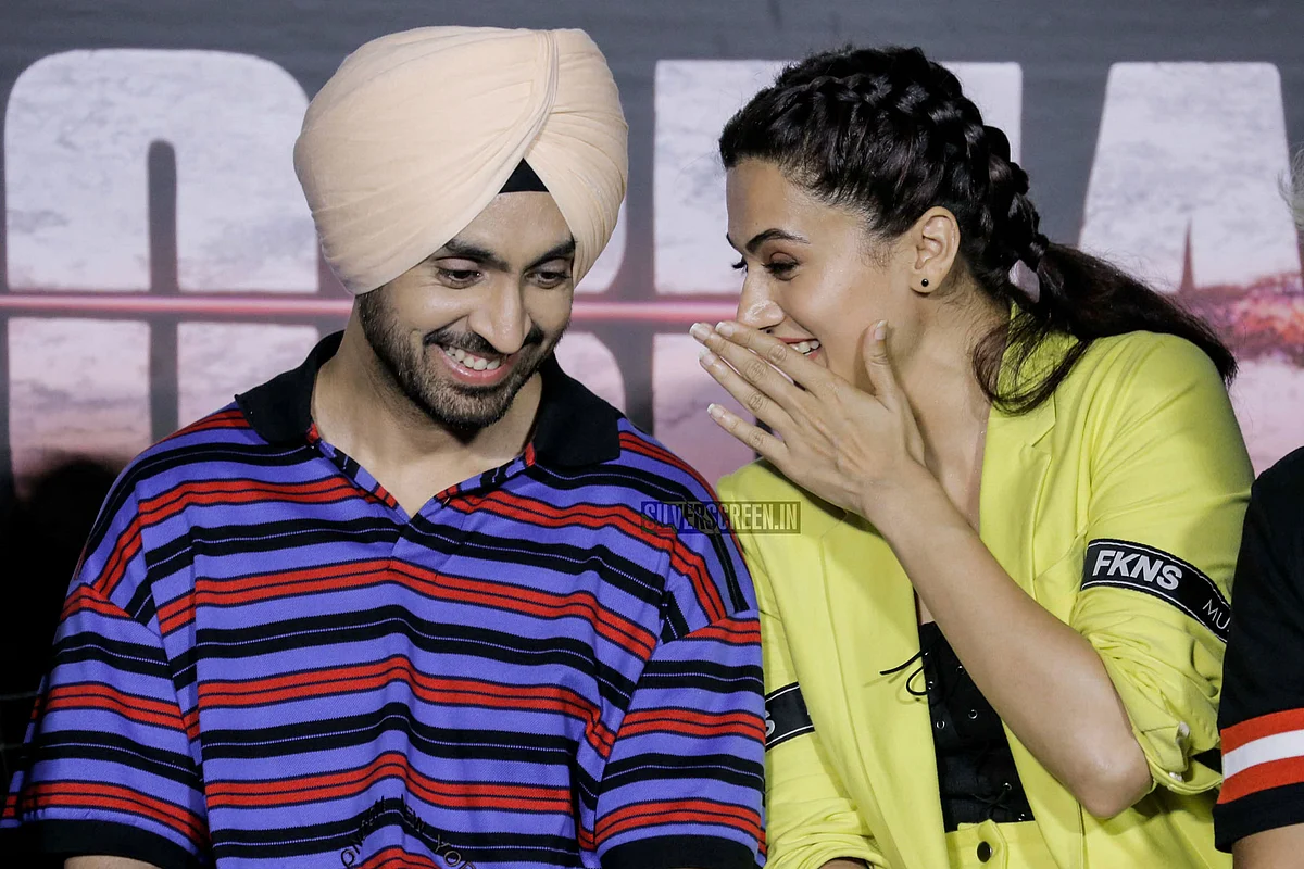 Taapsee Pannu with co-star, Diljit Dosanjh photographed at an event. 