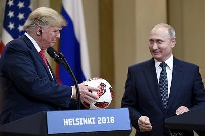 HELSINKI, July 16, 2018 (Xinhua) -- U.S. President Donald Trump (L) holds a soccer ball during a joint press conference with Russian President Vladimir Putin in Helsinki, Finland, on July 16, 2018. Donald Trump and Vladimir Putin started their first bilateral meeting here on Monday. (Xinhua/Lehtikuva/Antti Aimo-Koivisto/IANS)