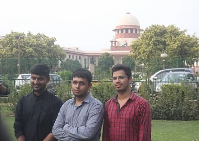 New Delhi: Krishna Reddy M, Romel Barel and Anwesh Pokkuluri - the three out of a batch of 20 current and former students of Indian Institutes of Technology who had filed a petition against Section 377 of the Indian Penal Code that makes homosexuality a crime, outside the Supreme Court, in New Delhi on July 10, 2018. (Photo: IANS)