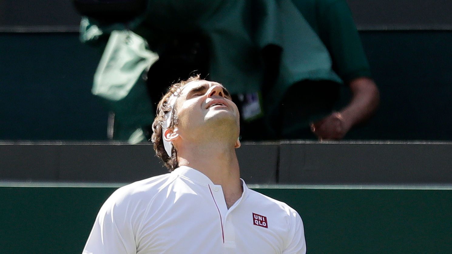 Roger Federer reacts after losing a point to Kevin Anderson during the Wimbledon quarter-final.