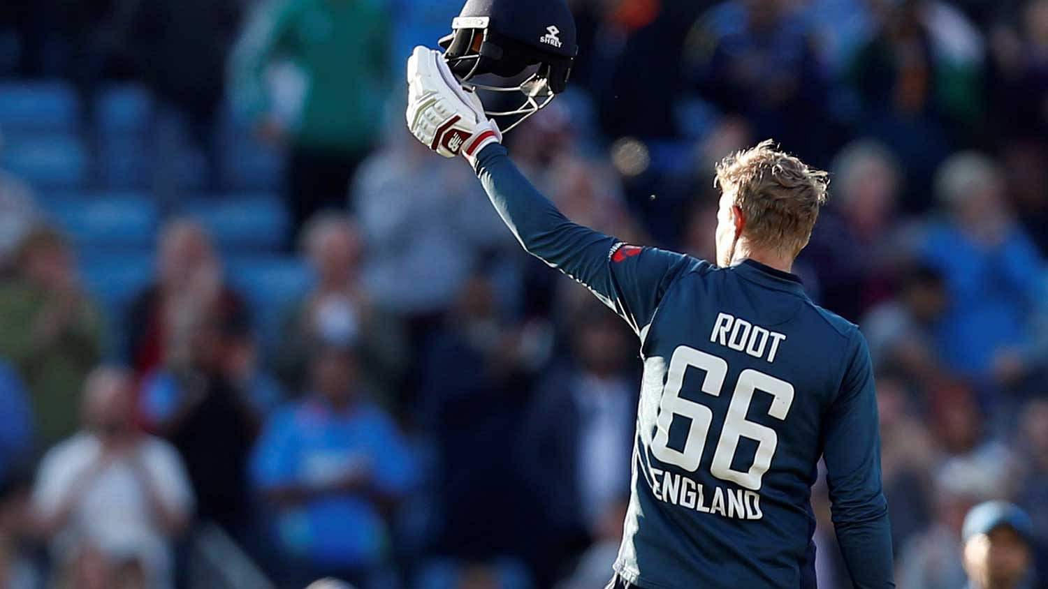  England’s Joe Root celebrates winning the match   against India.