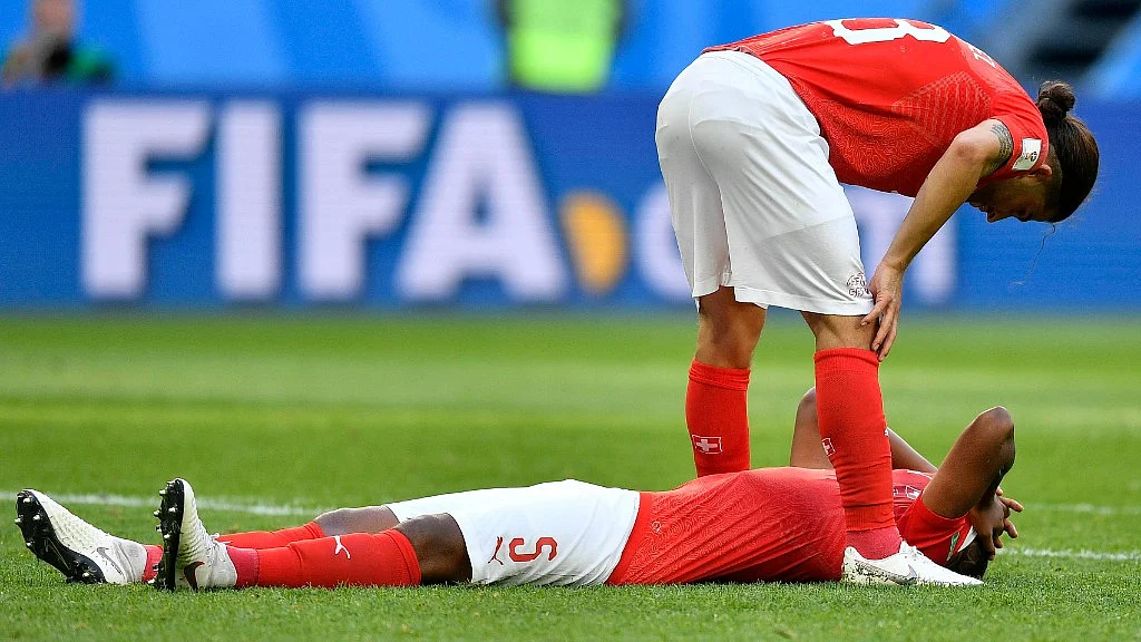 Switzerland’s Ricardo Rodriguez (top) and Switzerland’s Manuel Akanji react after their team lost their Round of 16 match against Sweden at the St. Petersburg Stadium on Tuesday.