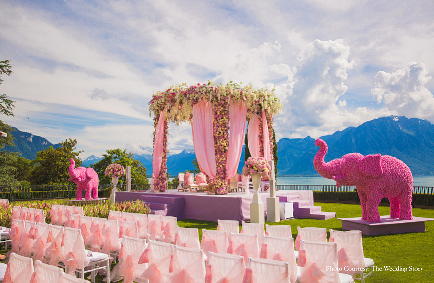 Two large elephants created using pink blooms made for the key decor elements.
