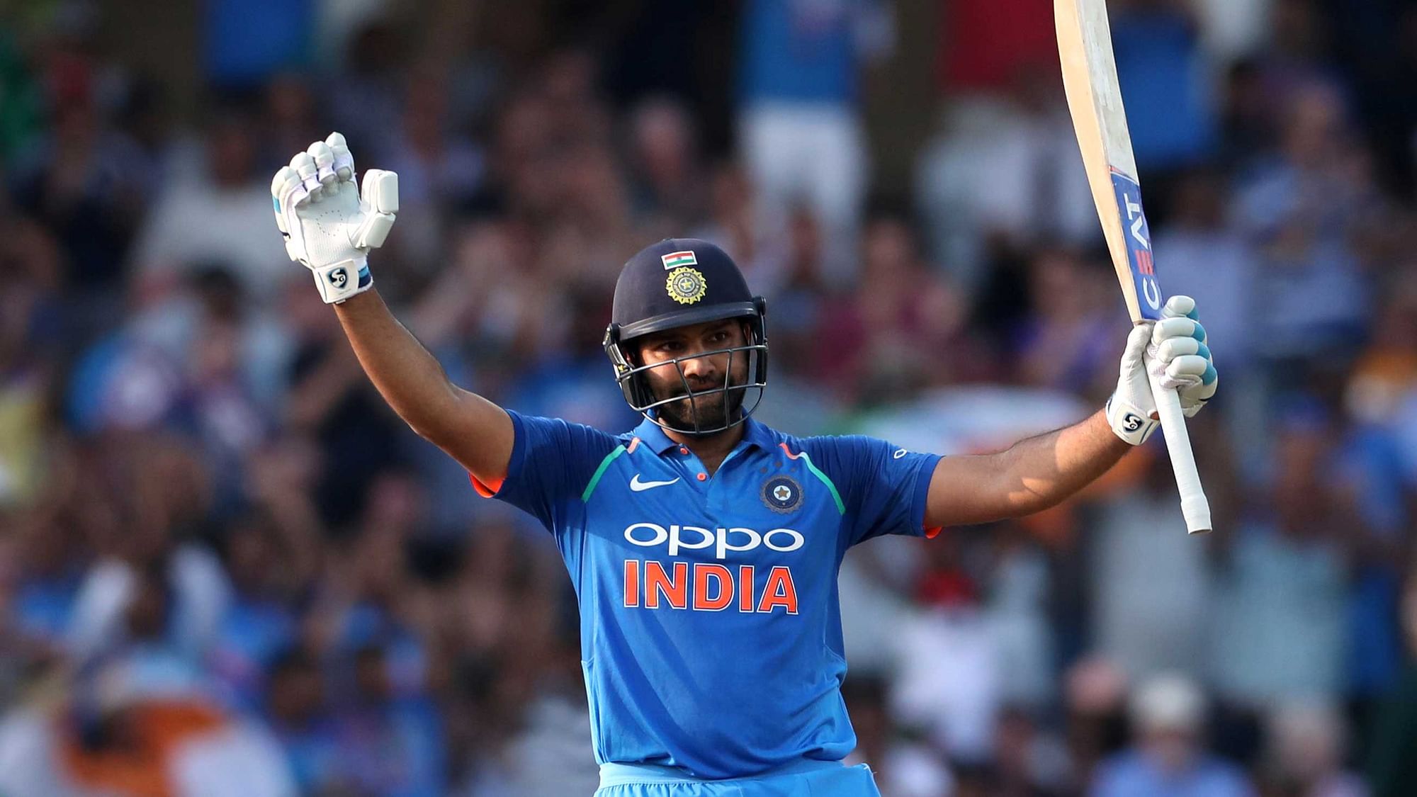 India’s Rohit Sharma celebrates reaching his century against England in the opening ODI