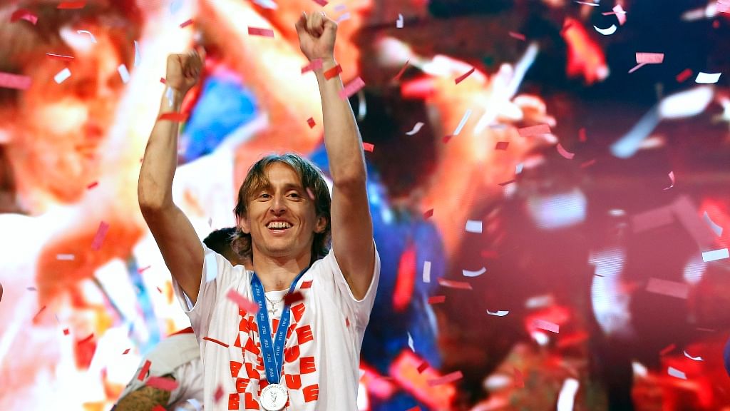 Croatia’s Luka Modric celebrates upon their arrival in Zagreb, Croatia.