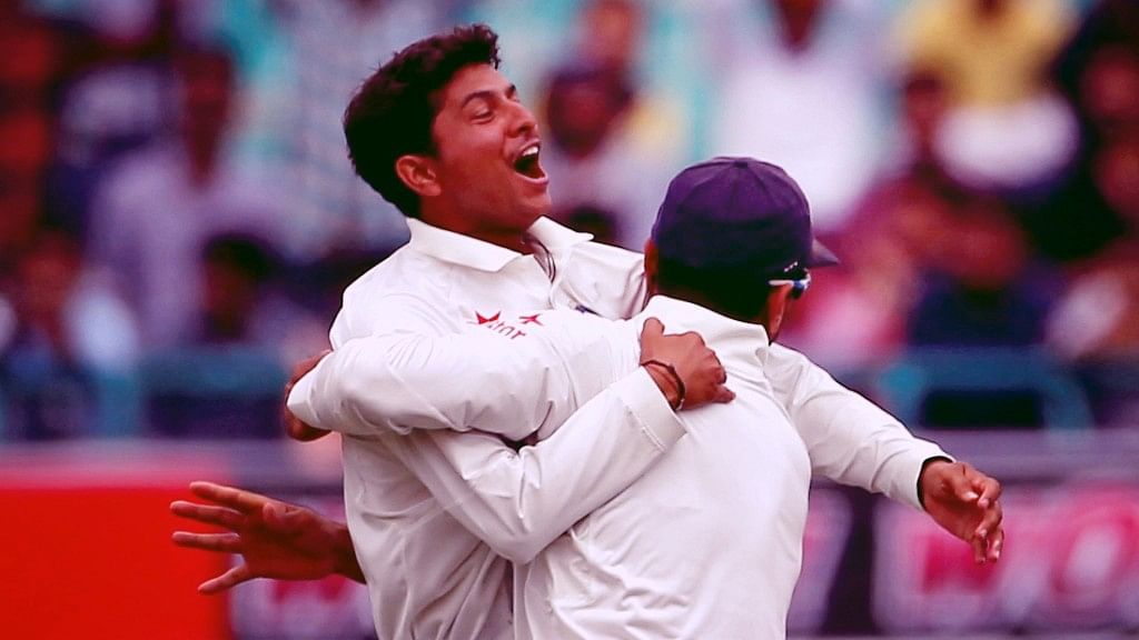 Kuldeep Yadav celebrates a wicket with Murali Vijay in his debut Test against Australia in 2017.
