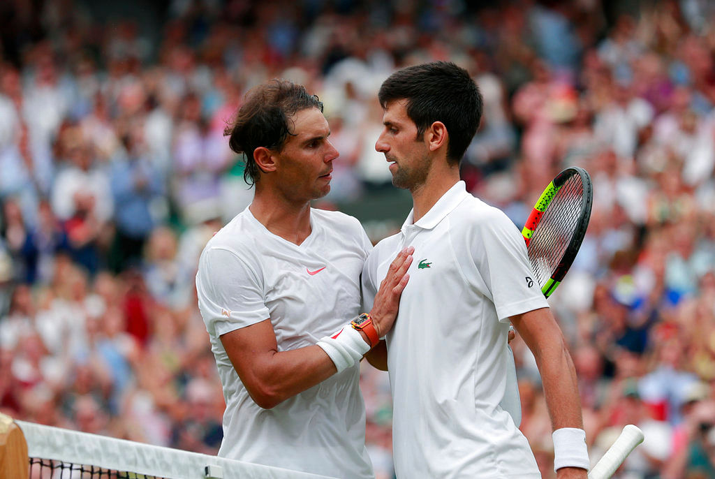 Novak Djokovic beat Rafael Nadal 6-4, 3-6, 7-6 (9), 3-6, 10-8 to set up a summit clash against Kevin Anderson.