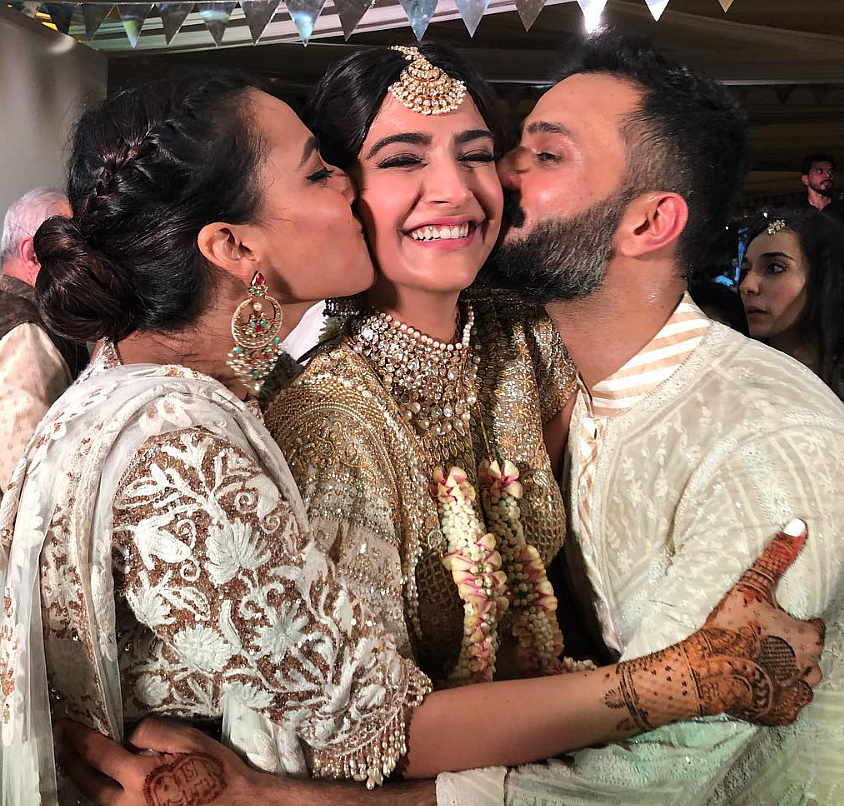BFF Swara Bhasker and groom, Anand Ahuja kiss the bride! Don’t miss the cute elephant mehendi design on the groom’s hand!