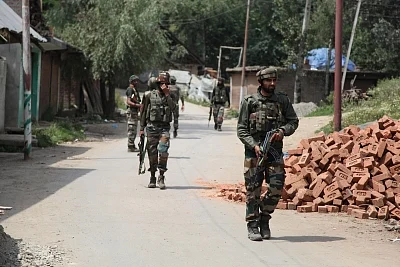 Shopian: Security personnel in action during an encounter with militants in Jammu and Kashmir