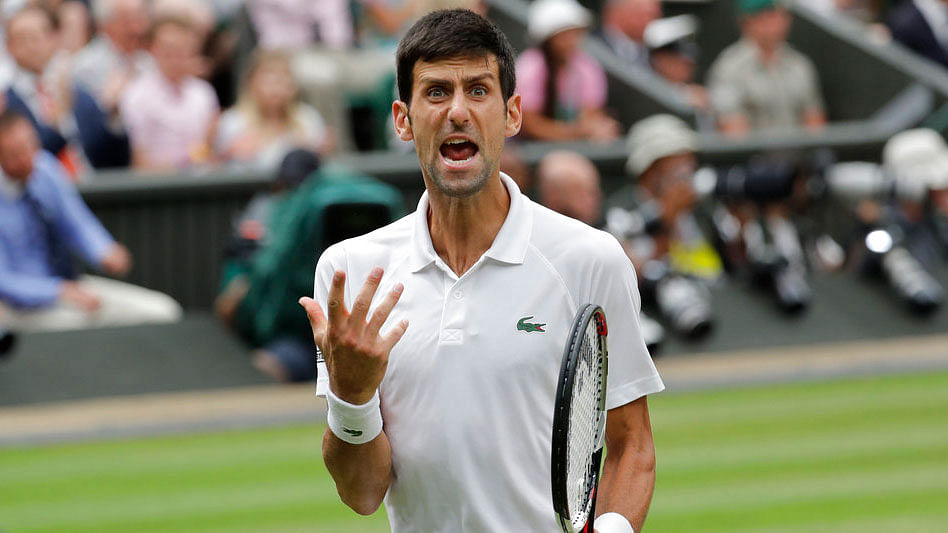 Novak Djokovic reacts during the Wimbledon semi-final against Rafael Nadal.